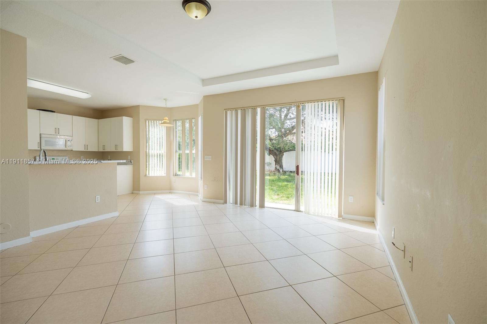 1770 Northeast 37th Place Homestead, FL 33033 - Photo 15 of 39 a view of a kitchen with an empty space and a window
