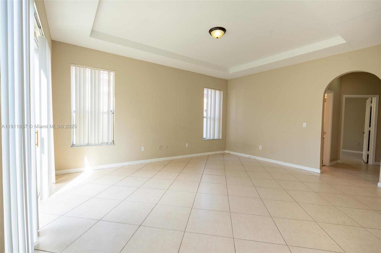 1770 Northeast 37th Place Homestead, FL 33033 - Photo 16 of 39 an empty room with windows and closet