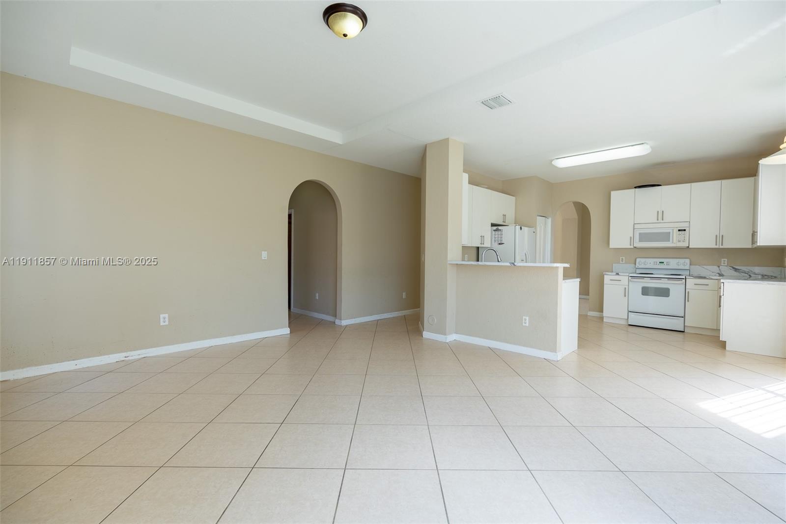 1770 Northeast 37th Place Homestead, FL 33033 - Photo 17 of 39 a view of a kitchen with a sink cabinets and a window
