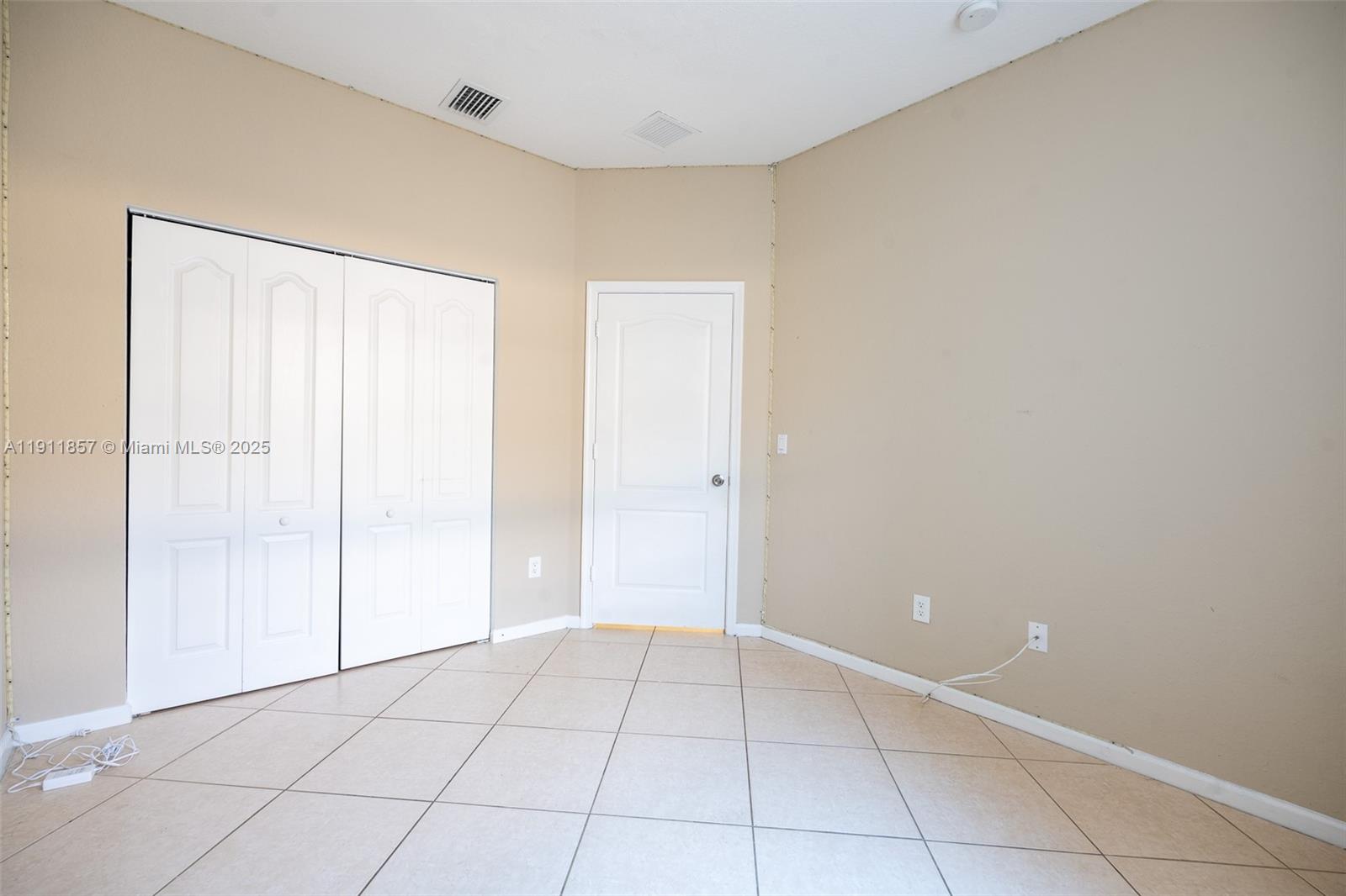 1770 Northeast 37th Place Homestead, FL 33033 - Photo 19 of 39 a view of an empty room with closet