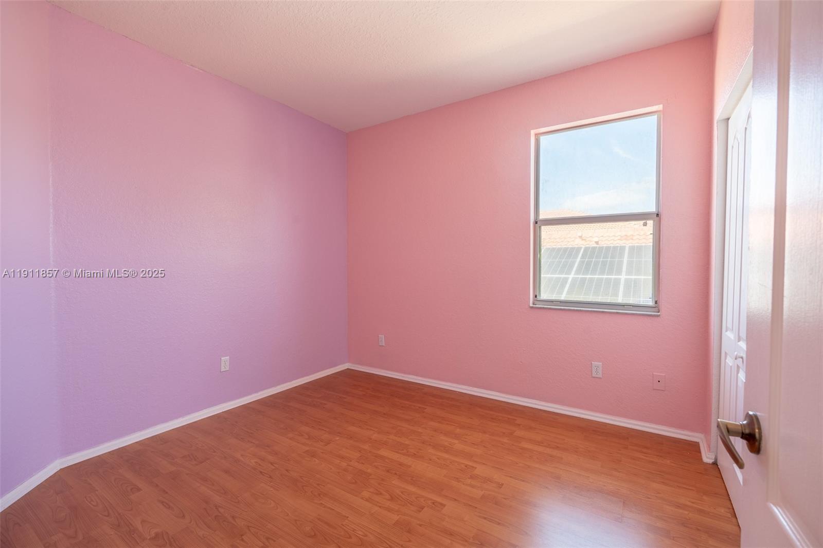 1770 Northeast 37th Place Homestead, FL 33033 - Photo 27 of 39 an empty room with a window