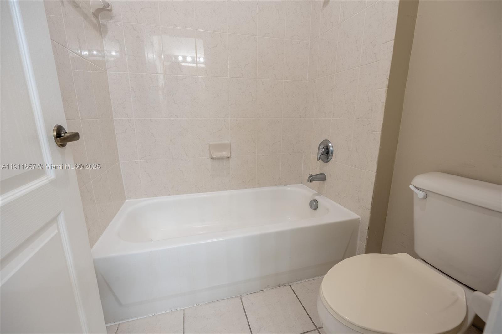 1770 Northeast 37th Place Homestead, FL 33033 - Photo 31 of 39 a white bath tub sitting next to a white toilet and sink