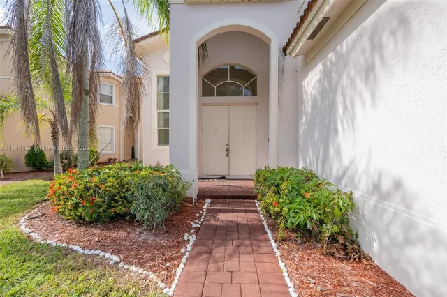 a front view of a house with garden