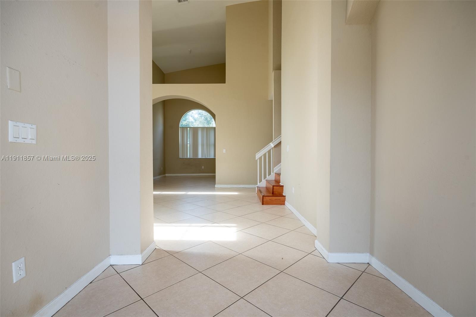 1770 Northeast 37th Place Homestead, FL 33033 - Photo 5 of 39 a view of a hallway to a livingroom with furniture
