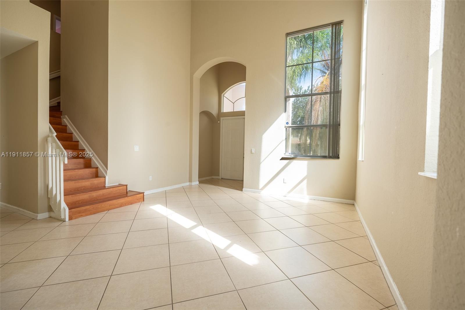 1770 Northeast 37th Place Homestead, FL 33033 - Photo 10 of 39 a view of a livingroom with wooden floor and entryway