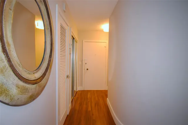 a view of a bathroom with a sink and a mirror