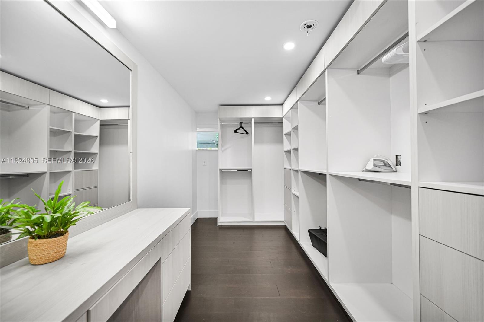 150 Northeast 50th Street, Unit A Miami, FL 33137 - Photo 17 of 100 a hallway with a potted plant on the counter