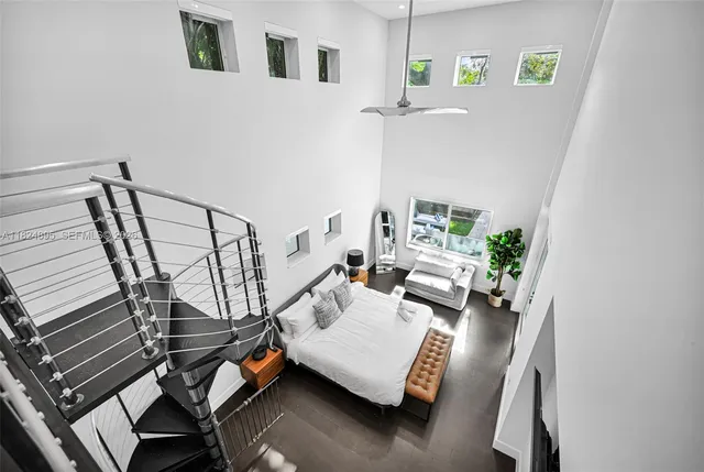 a kitchen with kitchen island granite countertop stainless steel appliances cabinets a sink and a counter top space