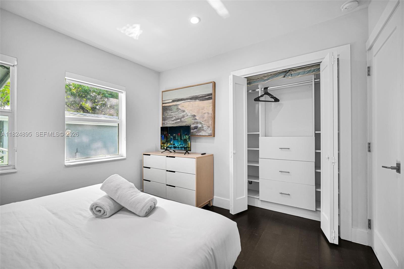 150 Northeast 50th Street, Unit A Miami, FL 33137 - Photo 32 of 100 a bedroom with a bed and a window