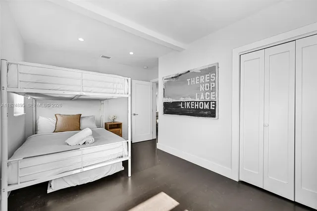 a bedroom with furniture and a window