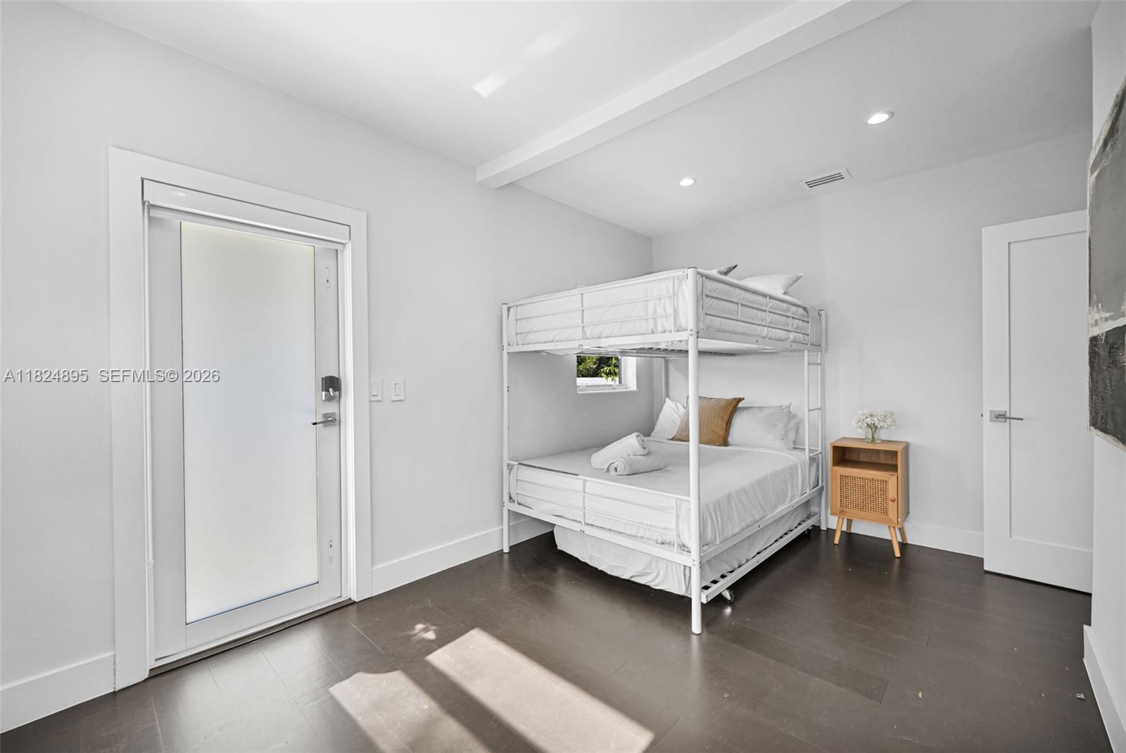 150 Northeast 50th Street, Unit A Miami, FL 33137 - Photo 35 of 100 a bedroom with a bed and a ceiling fan