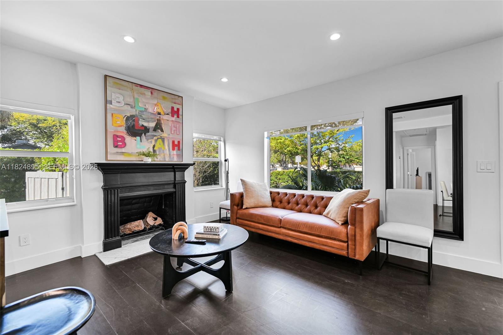 150 Northeast 50th Street, Unit A Miami, FL 33137 - Photo 43 of 100 a living room with furniture and a fireplace