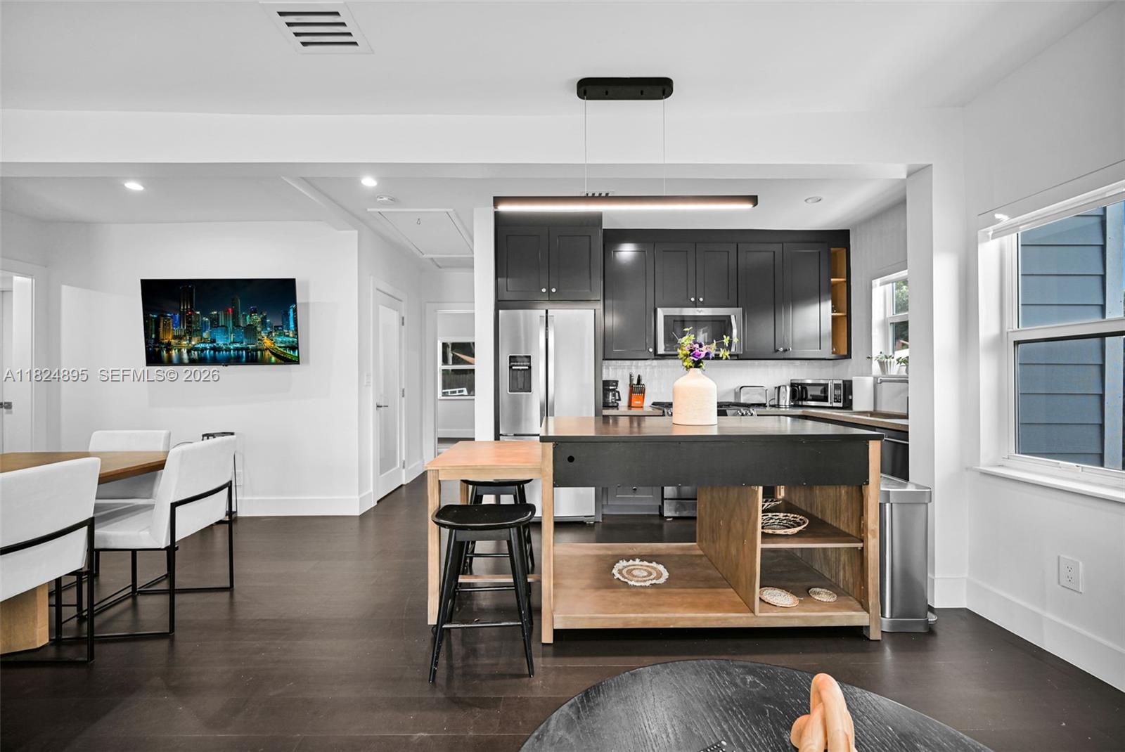 150 Northeast 50th Street, Unit A Miami, FL 33137 - Photo 45 of 100 a living room with furniture and a wooden floor