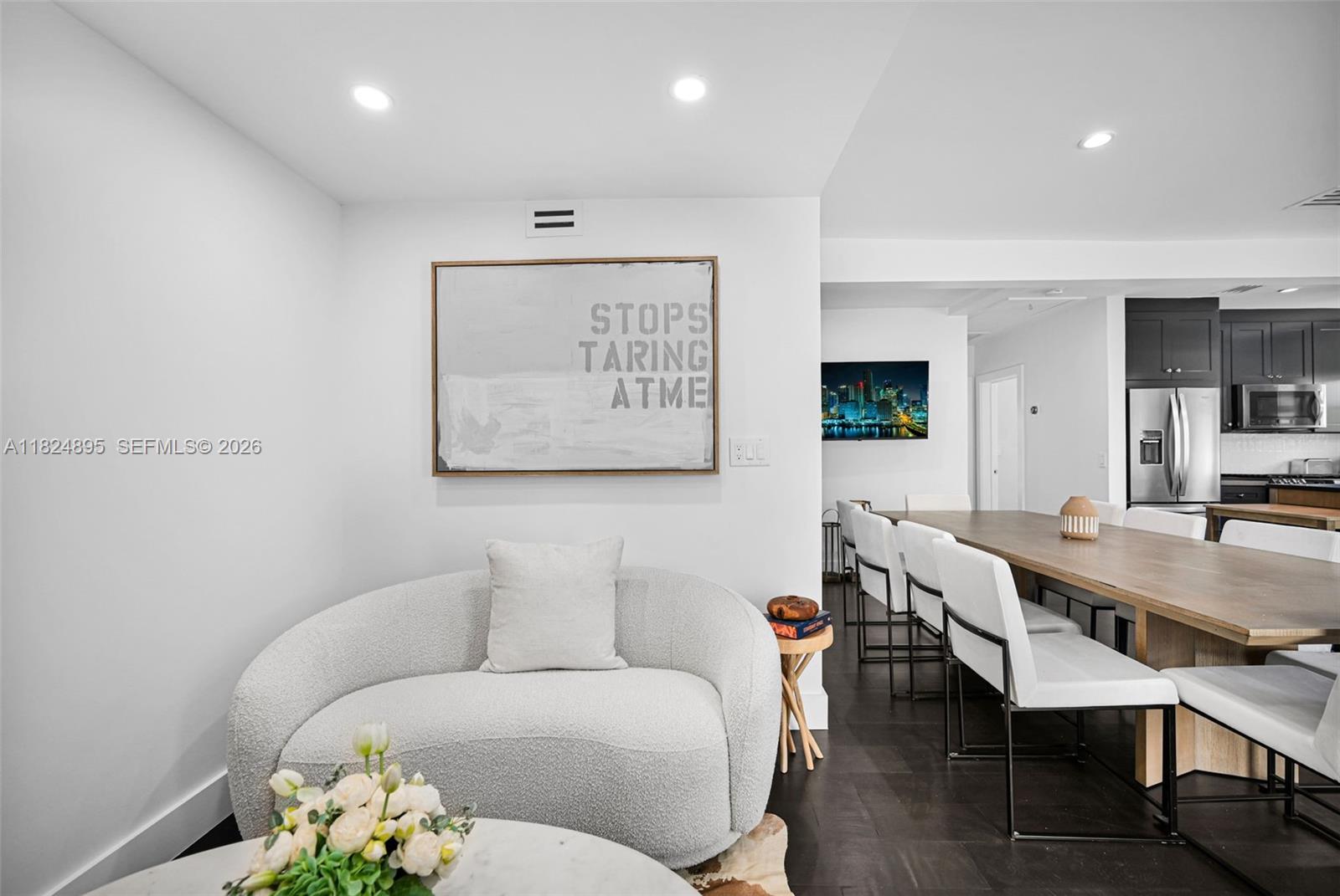 150 Northeast 50th Street, Unit A Miami, FL 33137 - Photo 57 of 100 a living room with furniture and a wooden floor