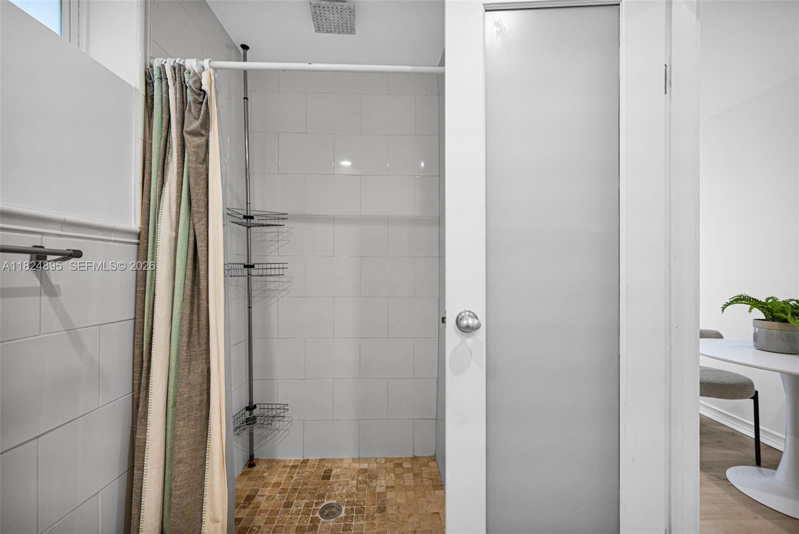 150 Northeast 50th Street, Unit A Miami, FL 33137 - Photo 67 of 100 a bathroom with a shower and a sink