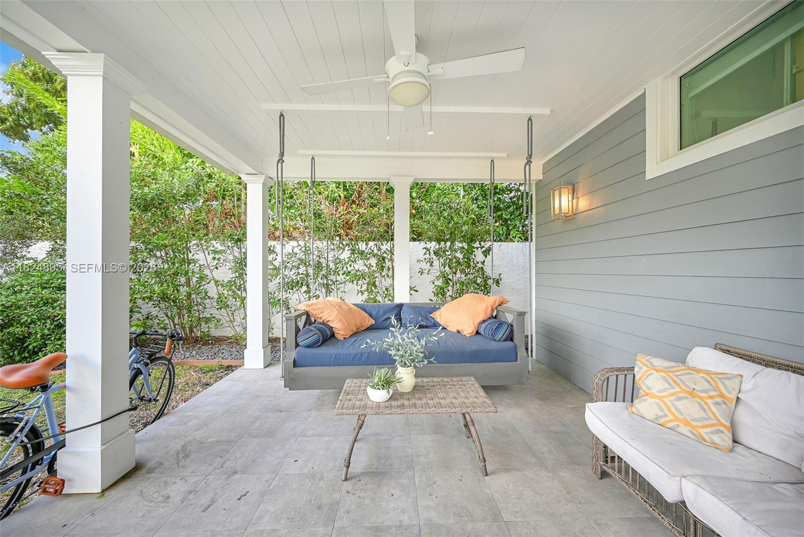 150 Northeast 50th Street, Unit A Miami, FL 33137 - Photo 74 of 100 a outdoor space with patio the couches and a dining table with the garden view