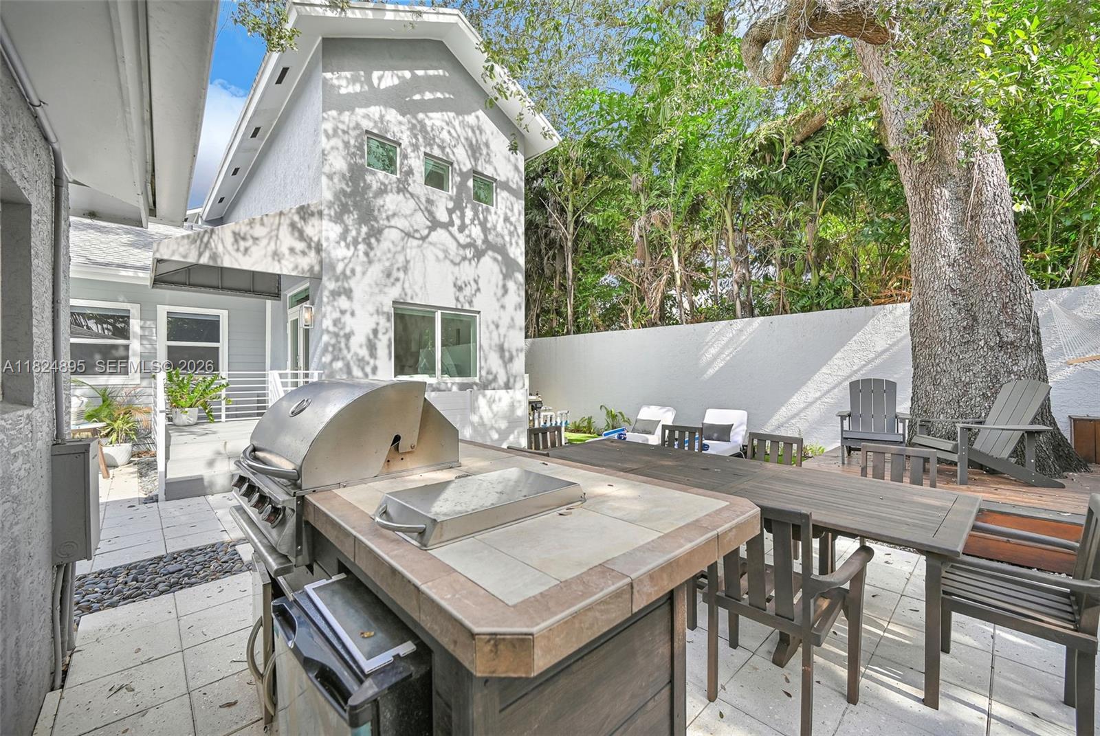 150 Northeast 50th Street, Unit A Miami, FL 33137 - Photo 8 of 100 a view of backyard of a house with seating space