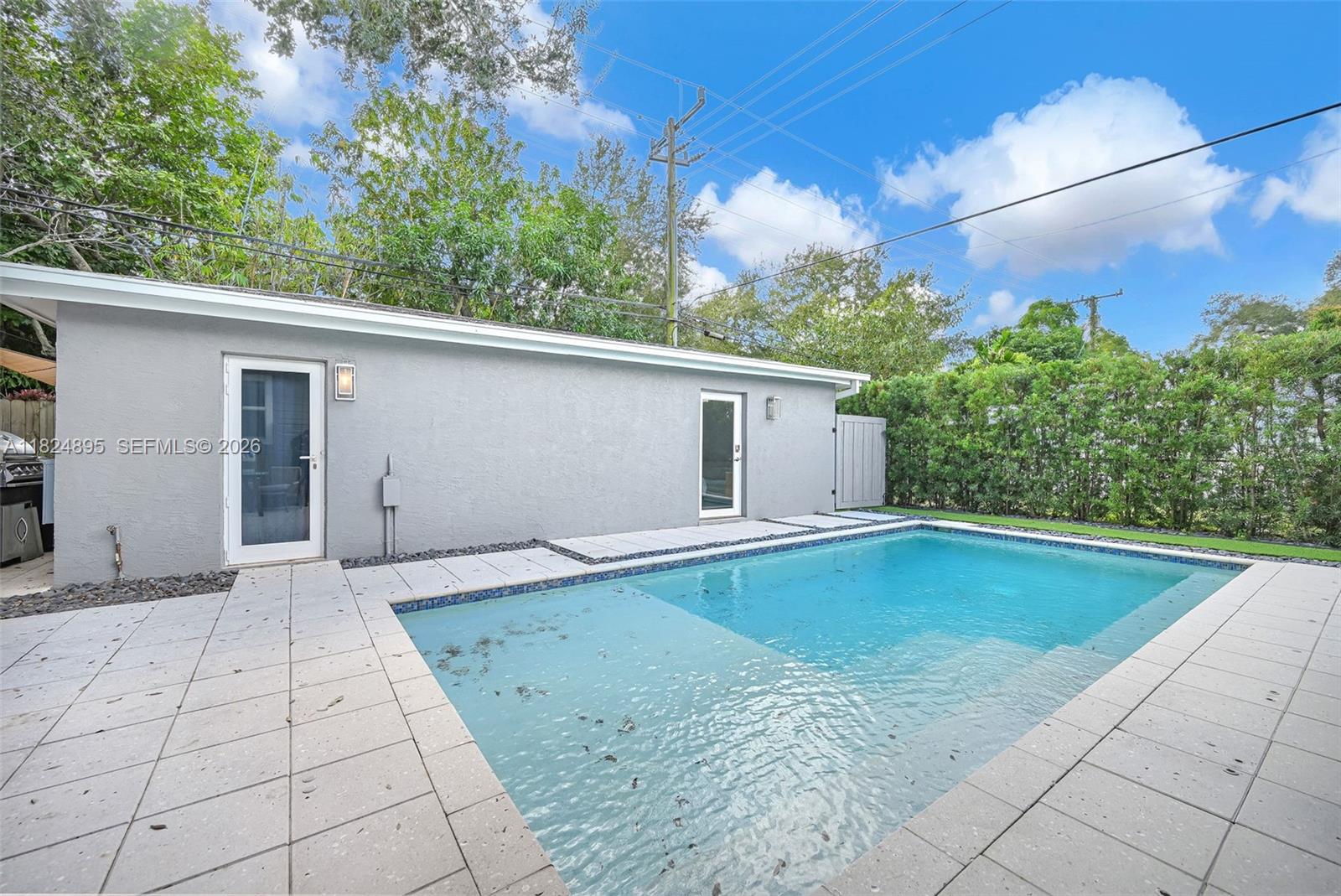150 Northeast 50th Street, Unit A Miami, FL 33137 - Photo 87 of 100 a view of a backyard space with potted plants
