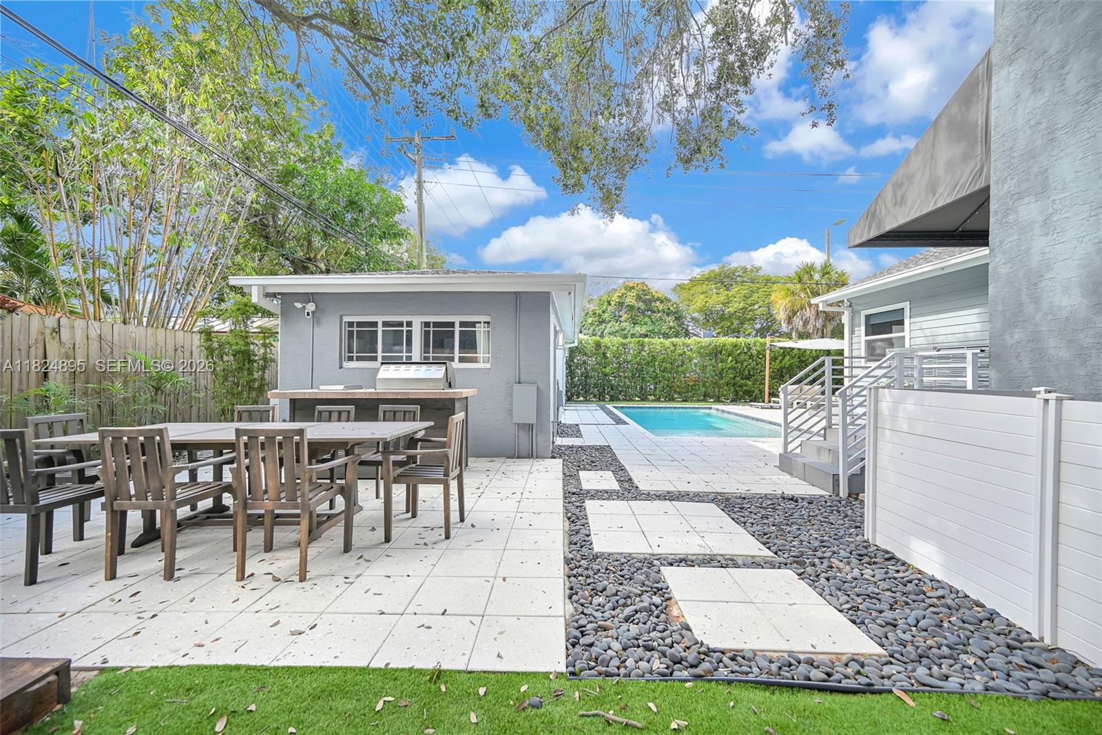 150 Northeast 50th Street, Unit A Miami, FL 33137 - Photo 91 of 100 a view of a house with backyard and sitting area
