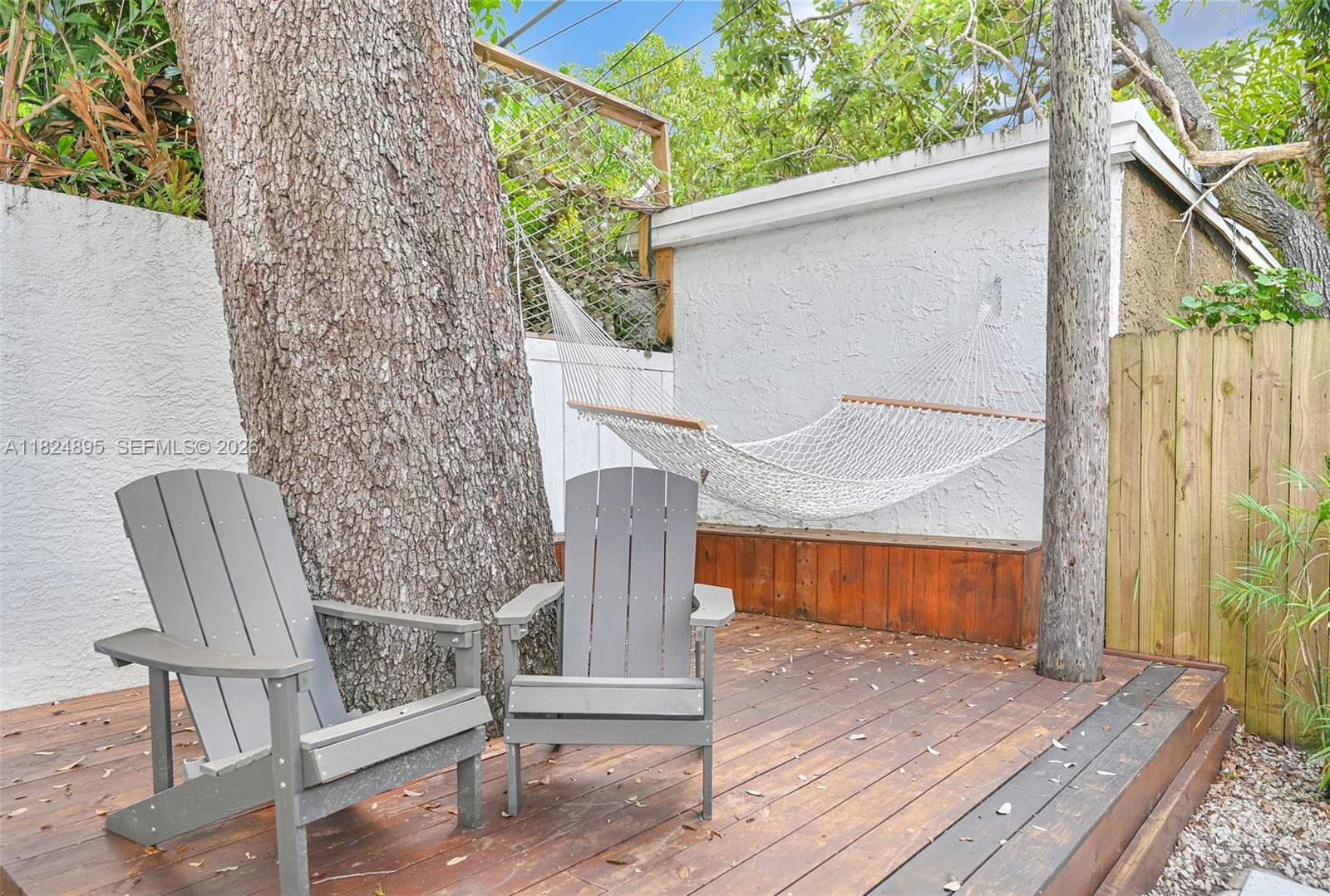 150 Northeast 50th Street, Unit A Miami, FL 33137 - Photo 92 of 100 a backyard of a house with seating space