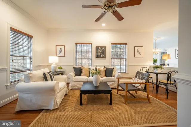 a living room with furniture and a lamp