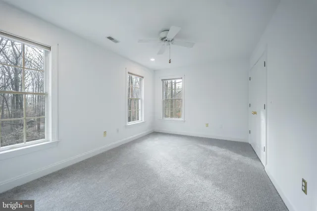 a bedroom with a bed and a closet