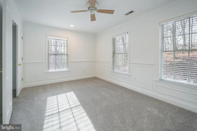 a white toilet sitting next to a shower curtain