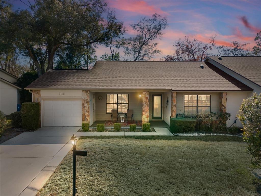 6580 Brambleleaf Drive Spring Hill, FL 34606 - Photo 1 of 1 a front view of a house with garden