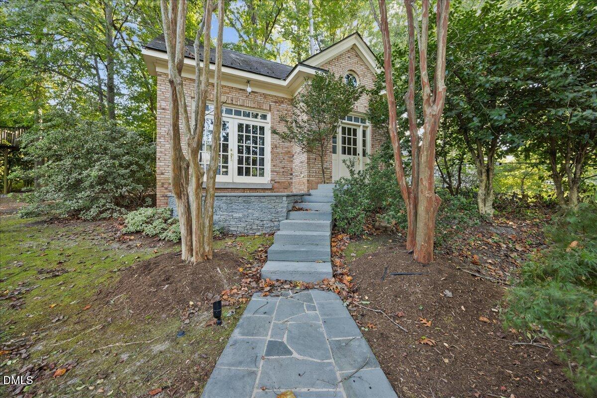2525 Glenwood Avenue Raleigh, NC 27608 - Photo 36 of 39 a front view of a house with a yard