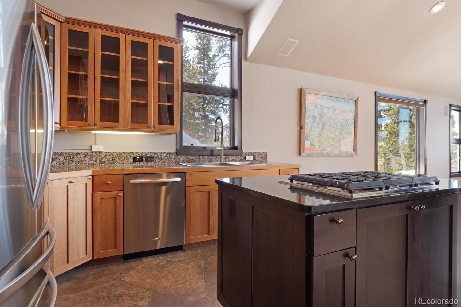 160 Fuller Placer Road Breckenridge, CO 80424 - Photo 20 of 47 a kitchen with granite countertop a stove and a sink
