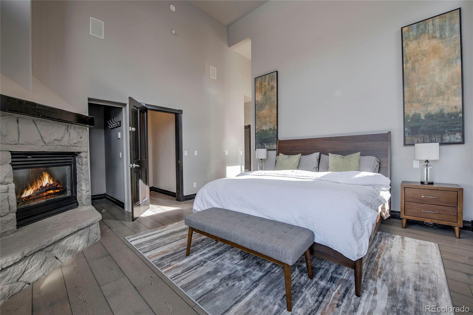 160 Fuller Placer Road Breckenridge, CO 80424 - Photo 25 of 47 a bedroom with a bed and a fireplace