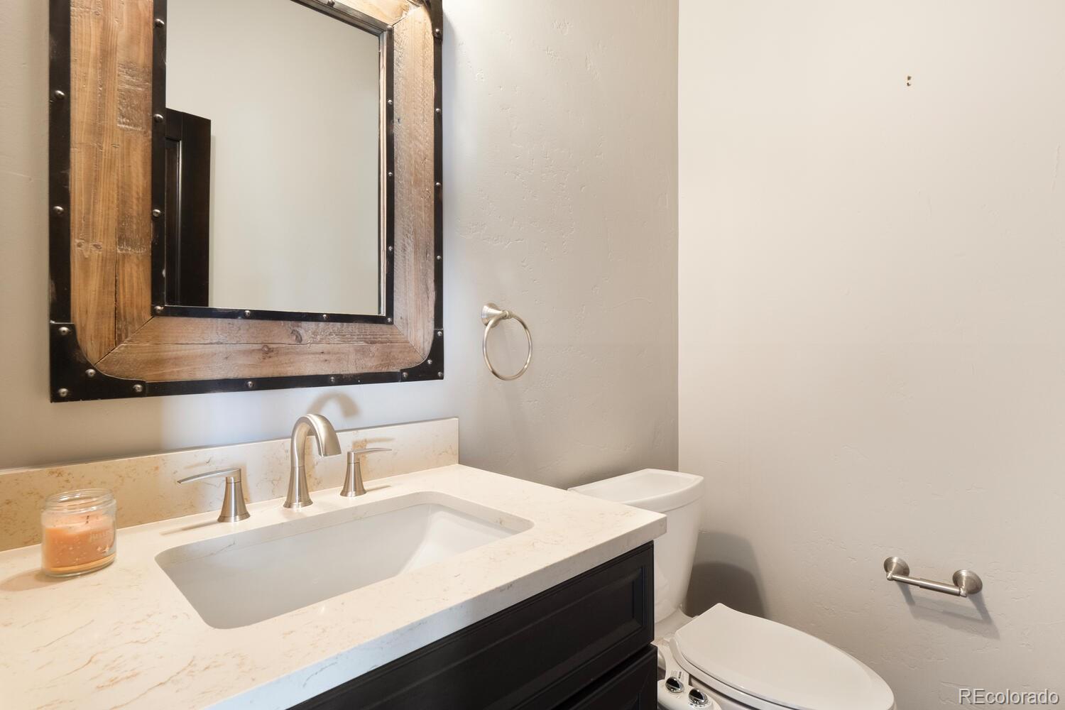 160 Fuller Placer Road Breckenridge, CO 80424 - Photo 34 of 47 a bathroom with a granite countertop toilet sink and mirror