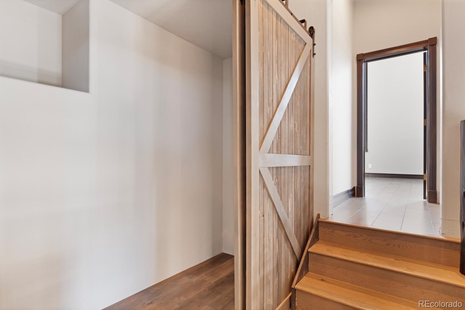 160 Fuller Placer Road Breckenridge, CO 80424 - Photo 46 of 47 a view of staircase with wooden floor and a rug