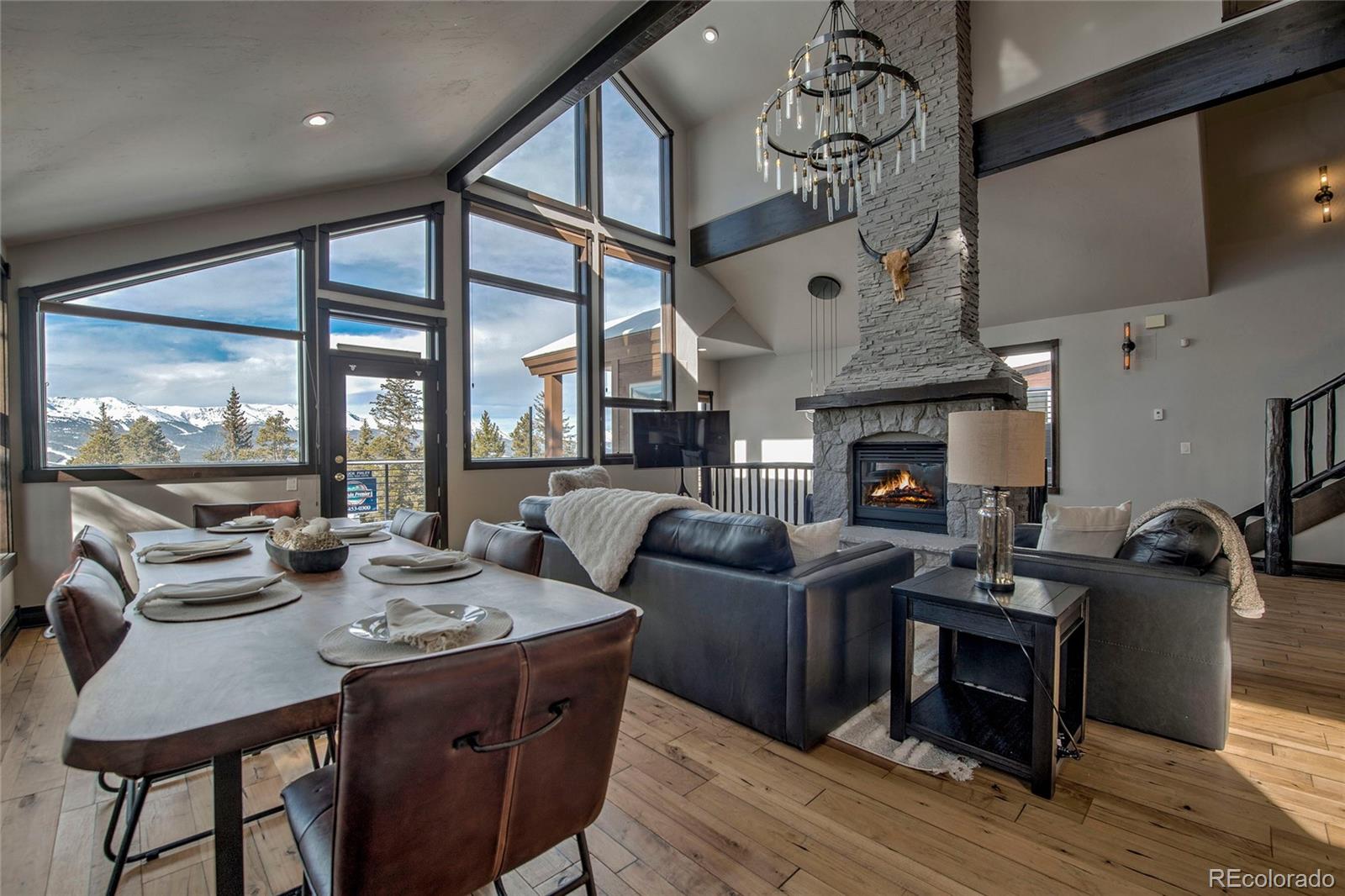160 Fuller Placer Road Breckenridge, CO 80424 - Photo 7 of 47 a living room with fireplace furniture and a large window