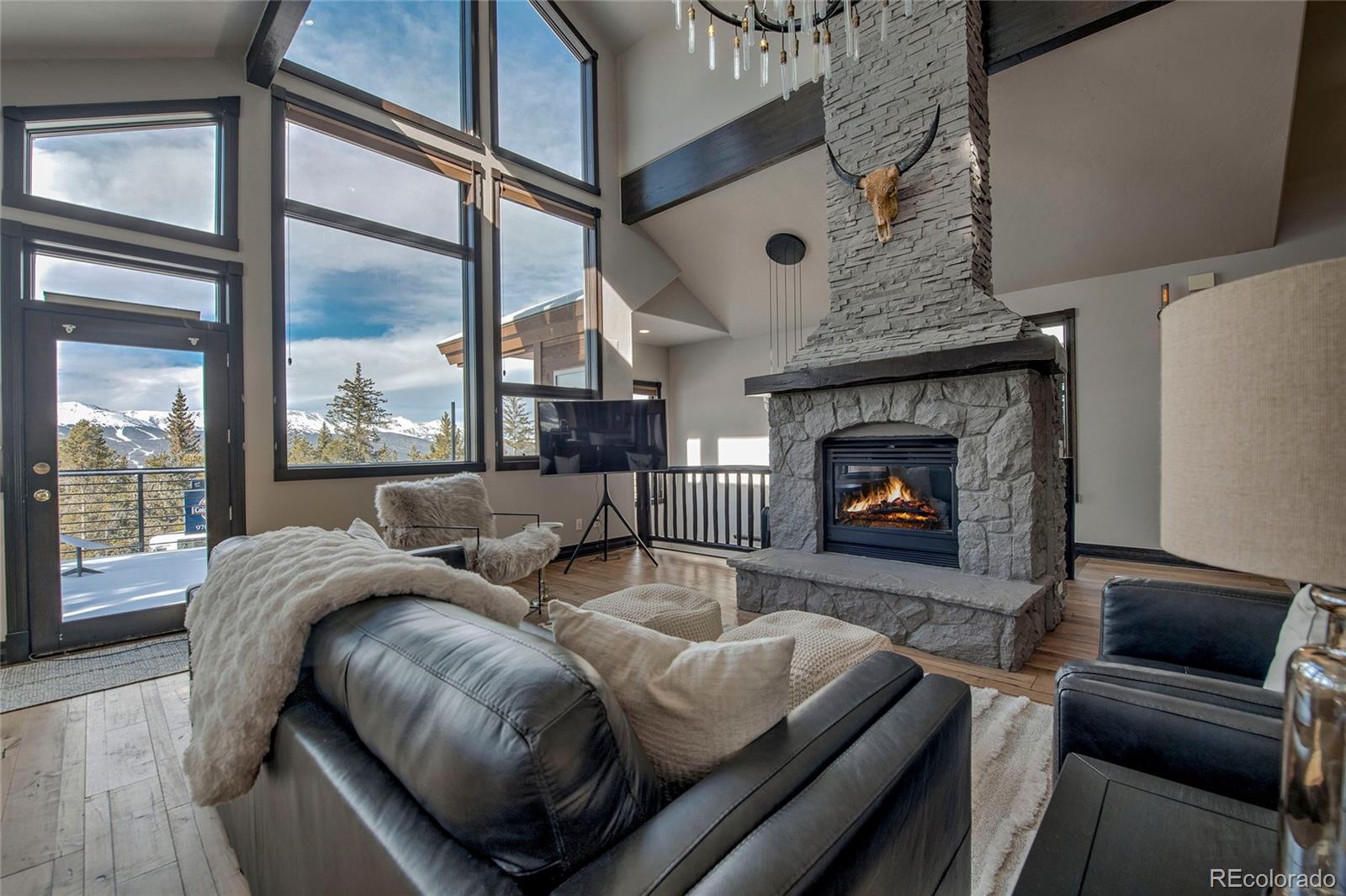 160 Fuller Placer Road Breckenridge, CO 80424 - Photo 8 of 47 a living room with furniture and a fireplace