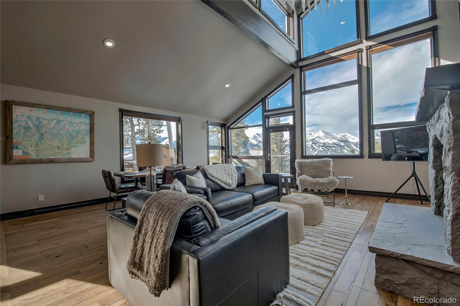 160 Fuller Placer Road Breckenridge, CO 80424 - Photo 9 of 47 a living room with furniture a large window and wooden floor