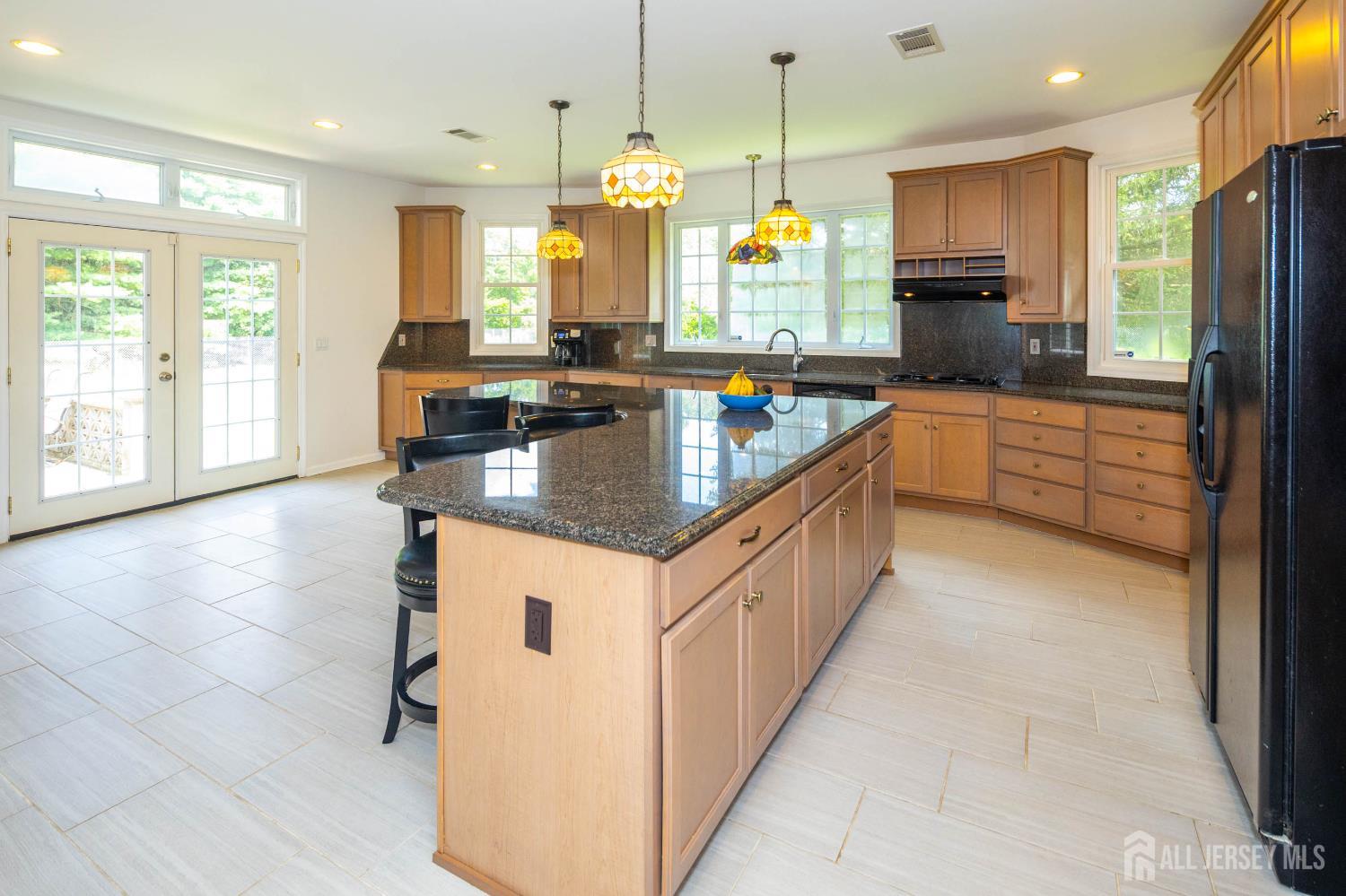 294 Fresh Ponds Road North Brunswick, NJ 08902 - Photo 12 of 53 a kitchen with granite countertop a sink a counter top space appliances and cabinets