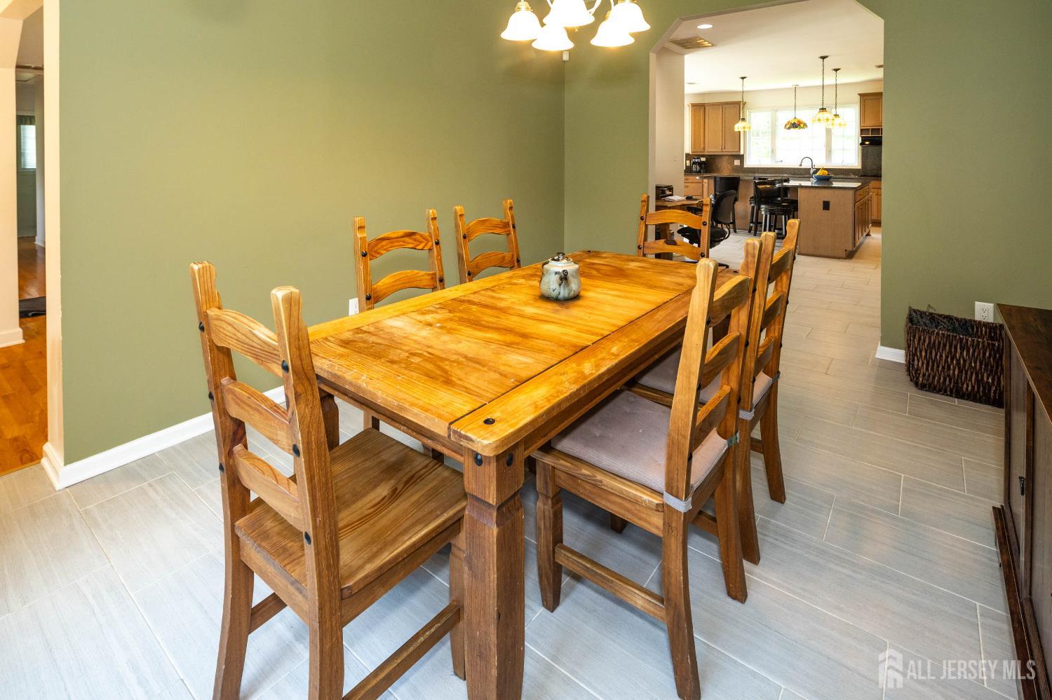 294 Fresh Ponds Road North Brunswick, NJ 08902 - Photo 17 of 53 a view of a dining room with furniture and wooden floor