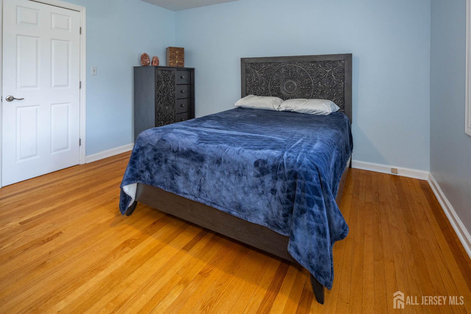 294 Fresh Ponds Road North Brunswick, NJ 08902 - Photo 23 of 53 a bed sitting in a bedroom next to a window