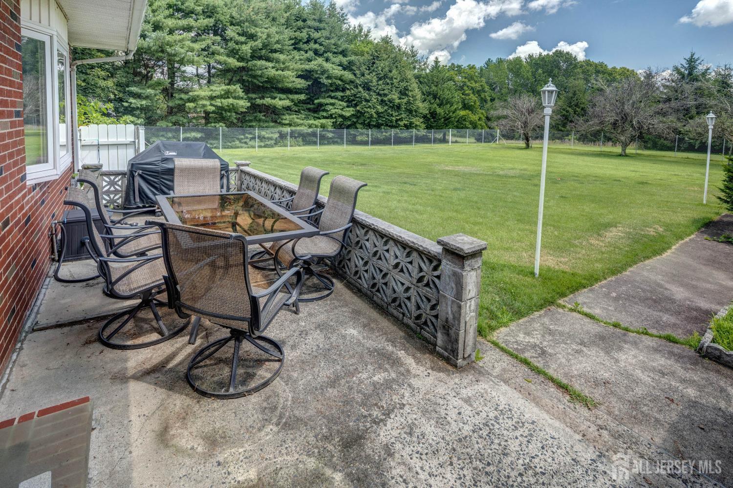 294 Fresh Ponds Road North Brunswick, NJ 08902 - Photo 33 of 53 a view of a table and chairs in the garden