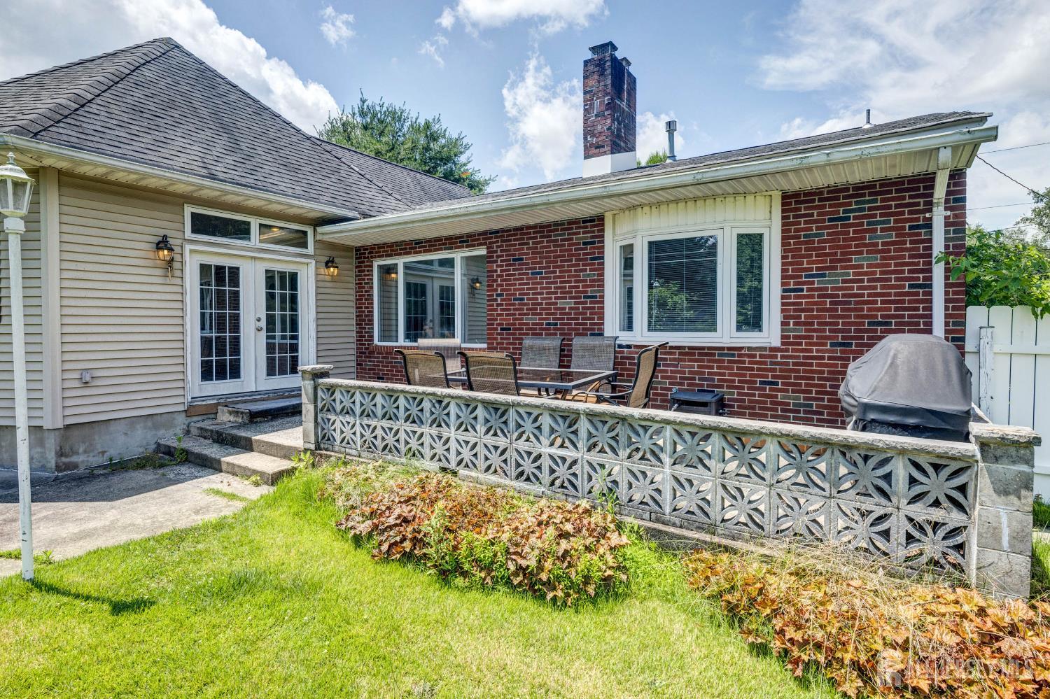 294 Fresh Ponds Road North Brunswick, NJ 08902 - Photo 35 of 53 a front view of a house with a garden and patio