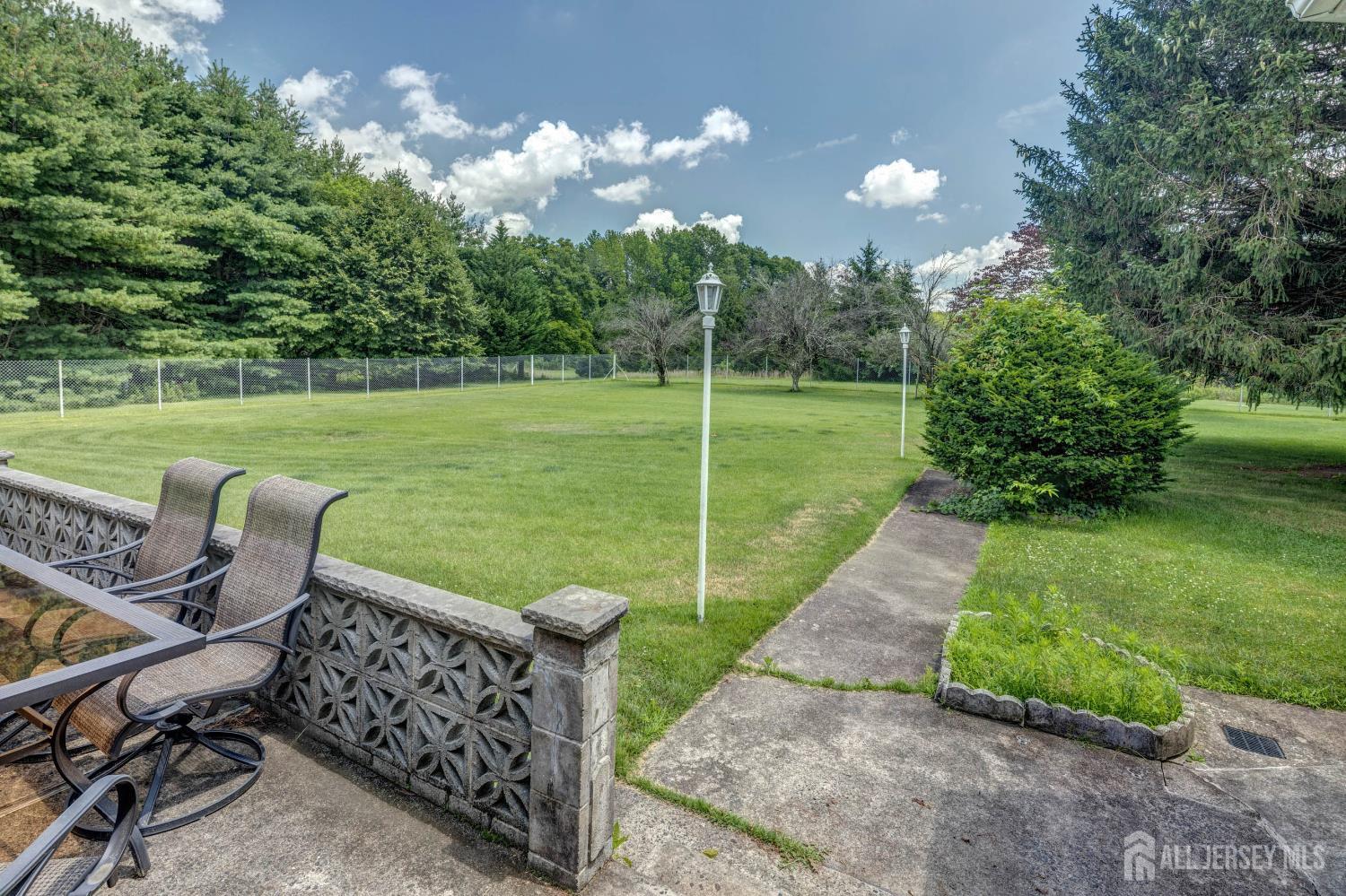 294 Fresh Ponds Road North Brunswick, NJ 08902 - Photo 36 of 53 a view of a chair and table on the garden