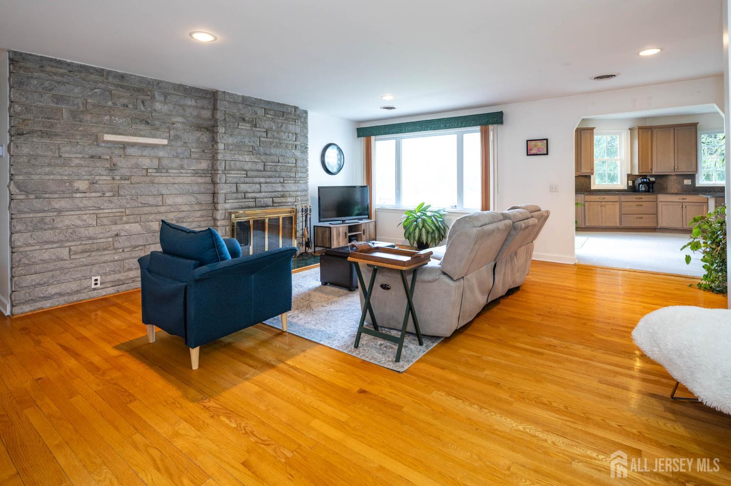 294 Fresh Ponds Road North Brunswick, NJ 08902 - Photo 4 of 53 a living room with furniture and a wooden floor