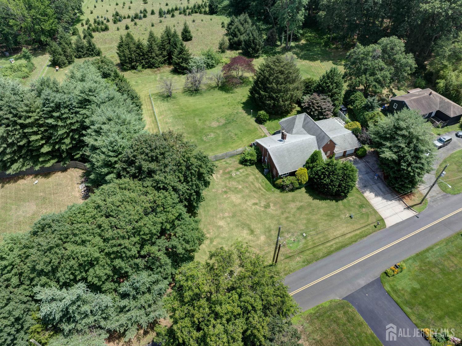 294 Fresh Ponds Road North Brunswick, NJ 08902 - Photo 44 of 53 an aerial view of a house with a yard