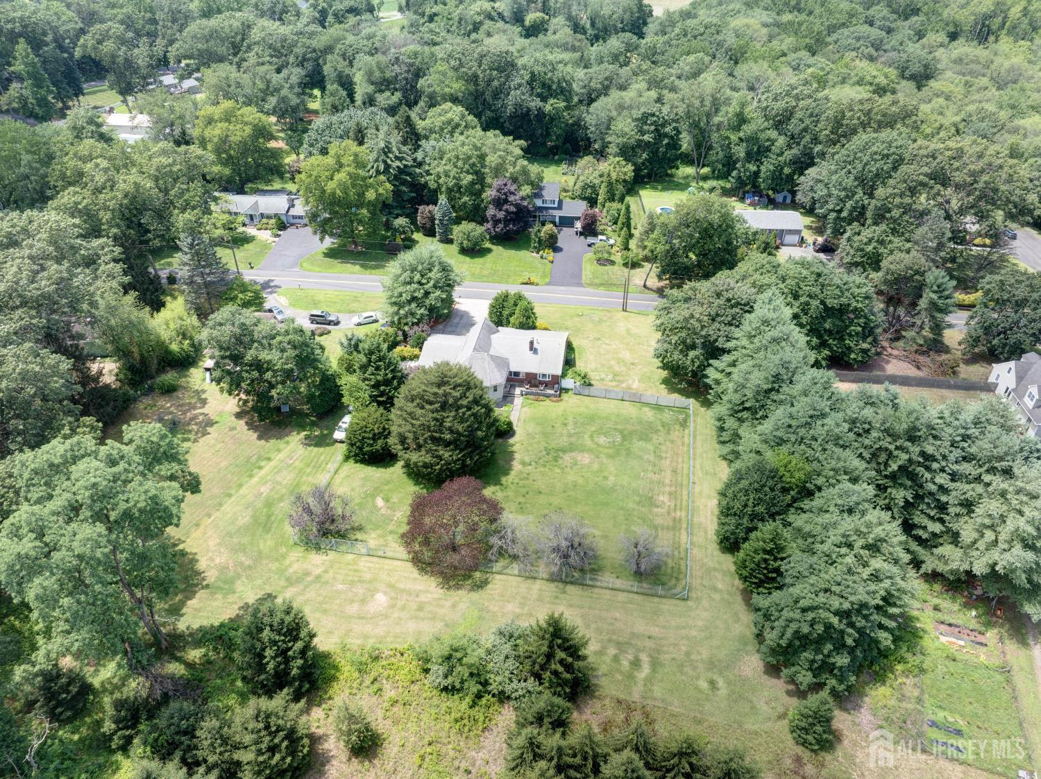 294 Fresh Ponds Road North Brunswick, NJ 08902 - Photo 48 of 53 an aerial view of a house with a yard and lake view