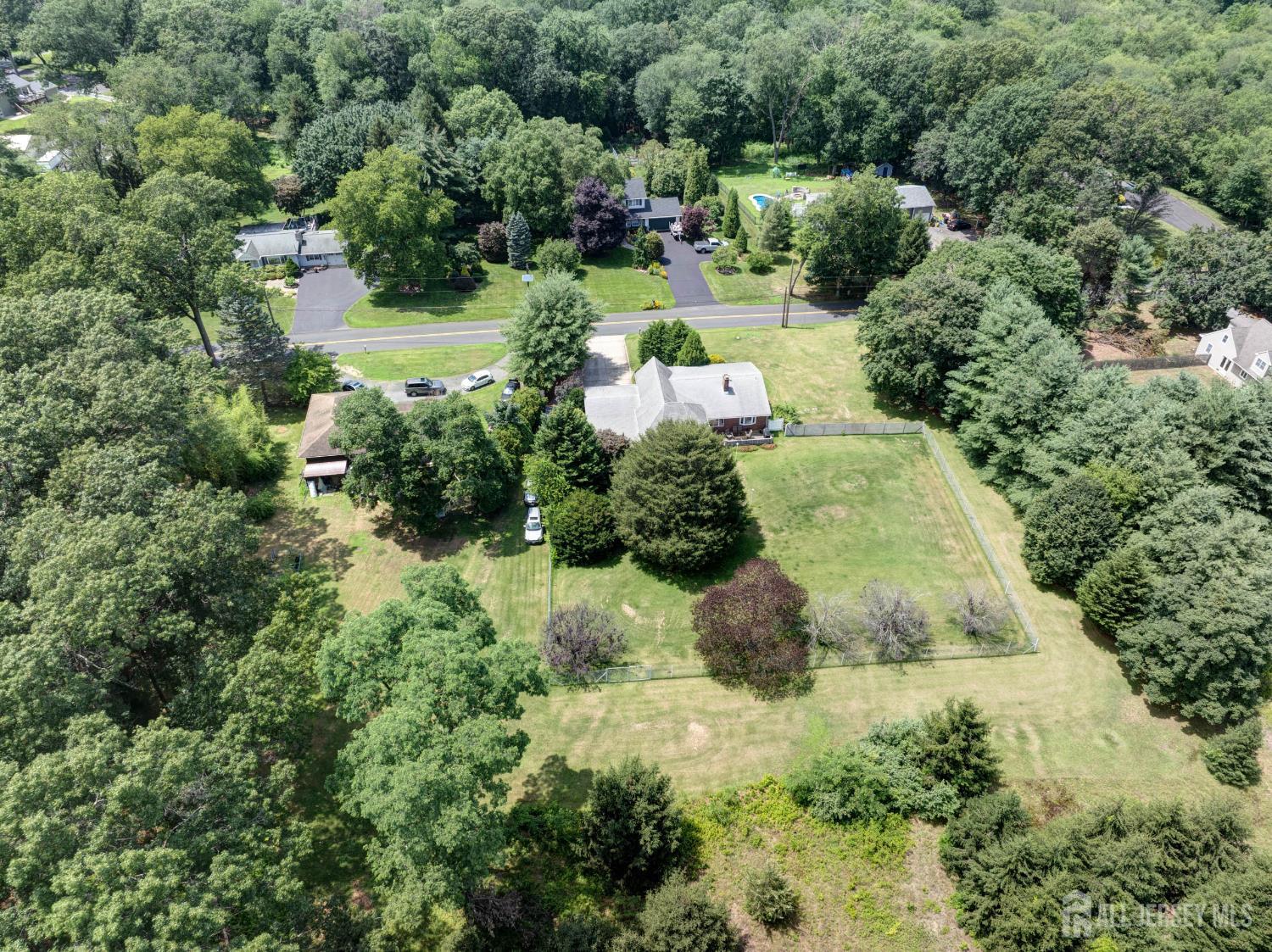 294 Fresh Ponds Road North Brunswick, NJ 08902 - Photo 49 of 53 an aerial view of a house with a yard and lake view