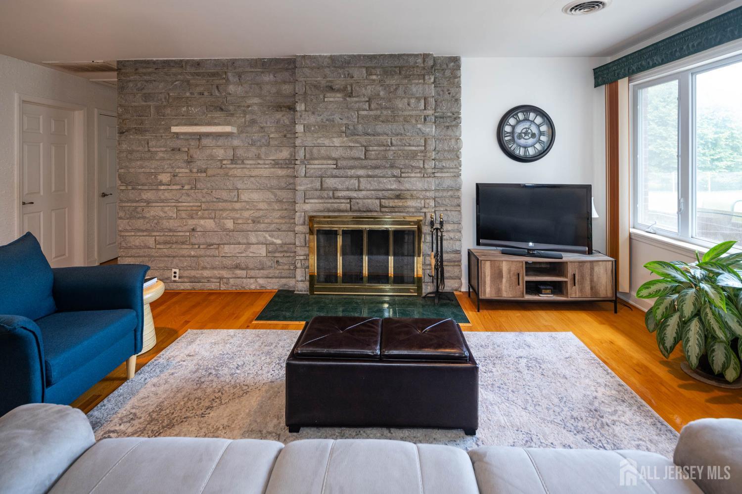 294 Fresh Ponds Road North Brunswick, NJ 08902 - Photo 8 of 53 a living room with furniture and a flat screen tv