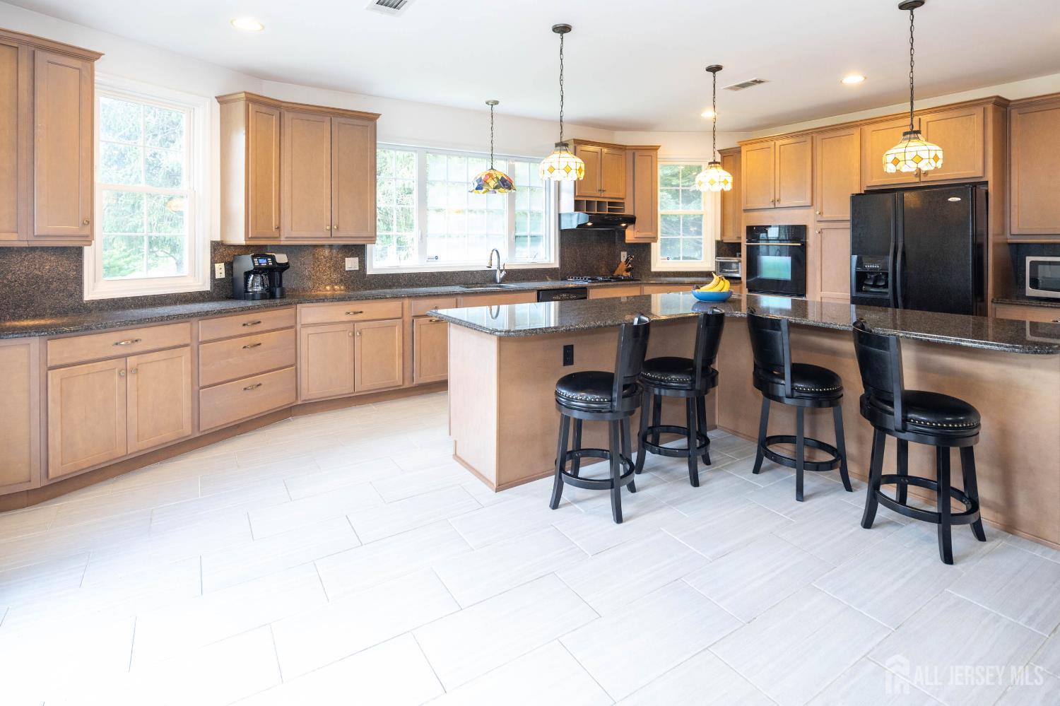 294 Fresh Ponds Road North Brunswick, NJ 08902 - Photo 9 of 53 a large kitchen with kitchen island a large island in the center