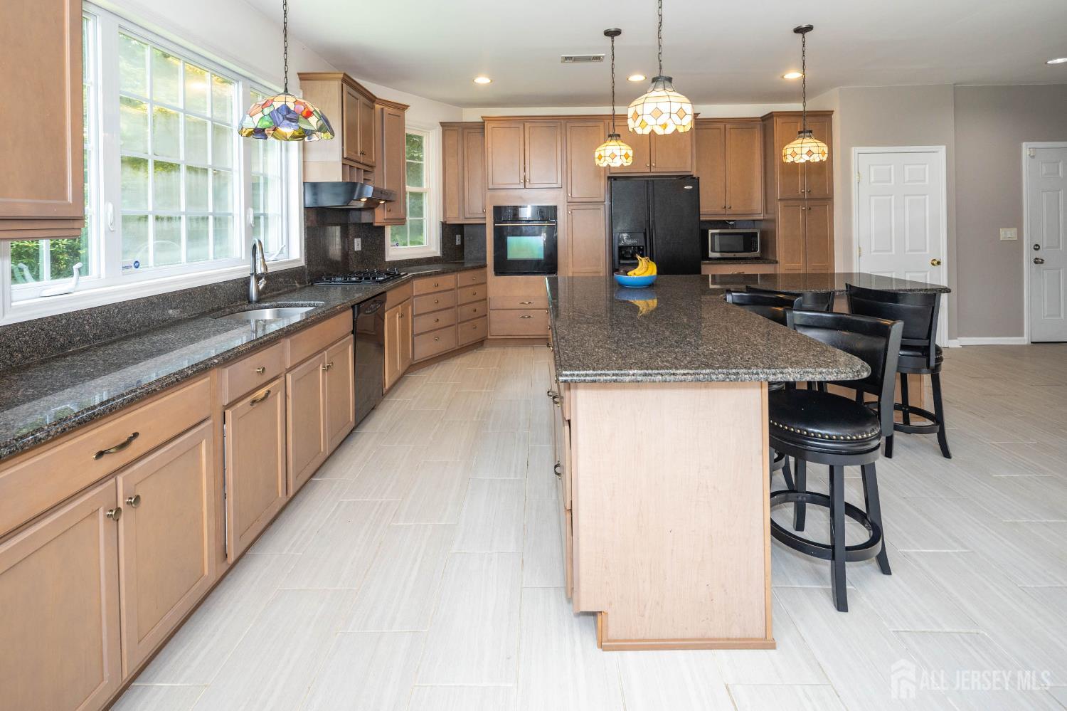 294 Fresh Ponds Road North Brunswick, NJ 08902 - Photo 10 of 53 a large kitchen with kitchen island a large counter space a sink appliances and a counter top space