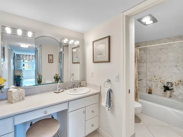 a bathroom with a bathtub and shower